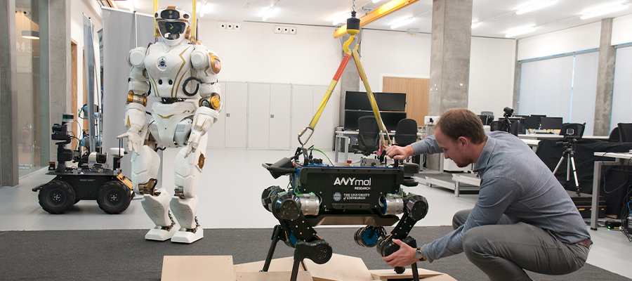 Researcher with robots