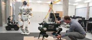 Researcher with robots