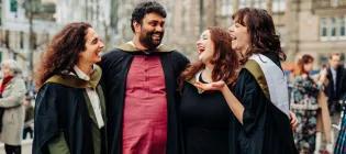 Four graduating students in Bristo Square