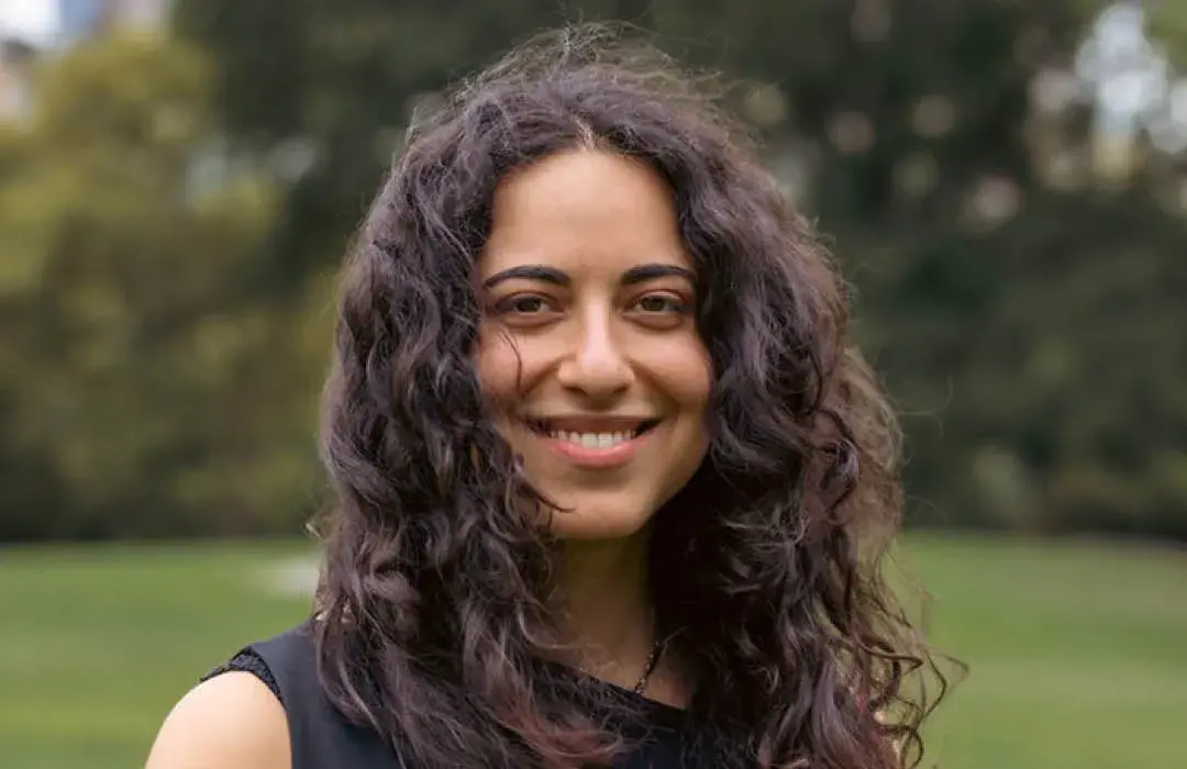 Headshot of Safoora Biglari taken in a park. 