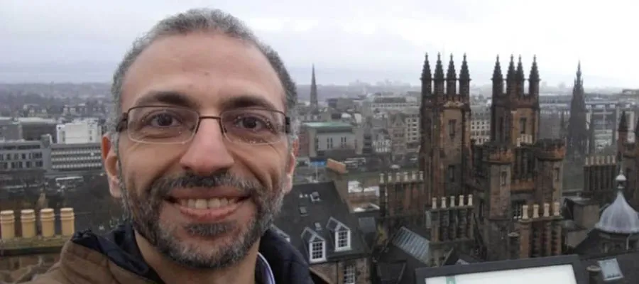 Ahmed Hamam with New College in the background
