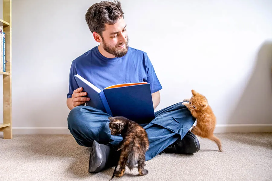 UK Pet Poet Laureate 2018-19 Russell Jones reads to a kitten.