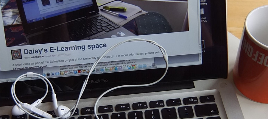 A student's laptop and coffee cup 