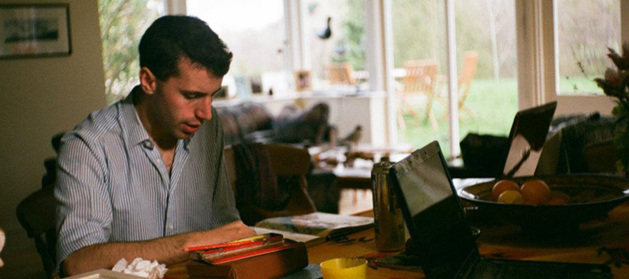 James Albon illustrating at his desk.